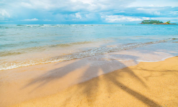 istock Beach sand and sea coastline. Selective focus. 1199410417