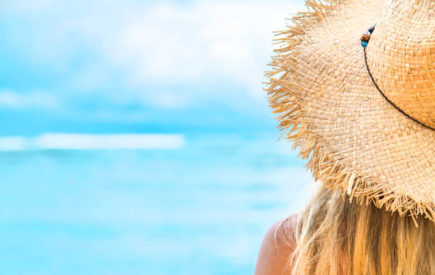 istock Girl on the beach by the ocean. Selective focus. 1199410424