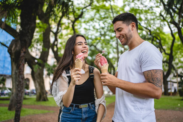 istock Happy Hispanic couple enjoying ice cream 1199412006