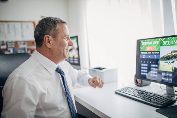 istock An older businessman bets online from the office 1199414688