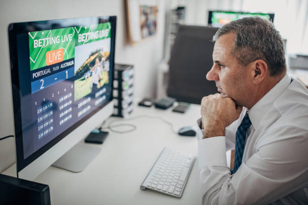 istock An older businessman bets online from the office 1199415119