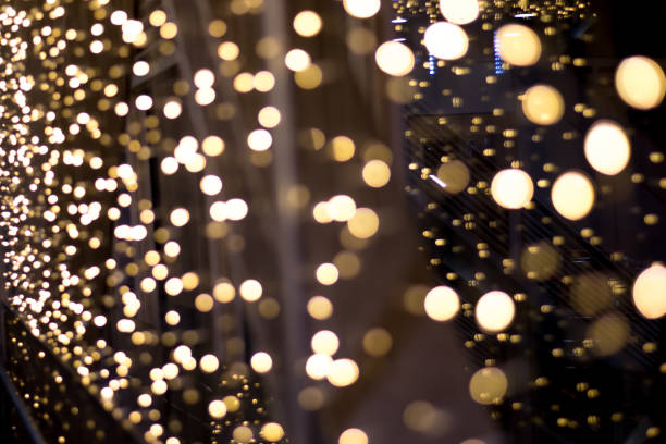 istock Golden christmas background with bokeh lights. 1199415932
