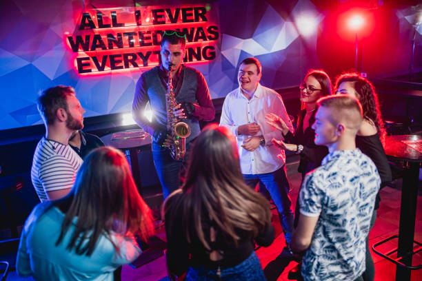 istock Saxophonist on club party 1199416172