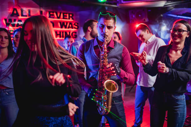 istock Saxophonist on club party 1199416221