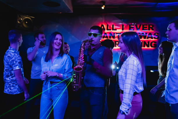 istock Saxophonist on club party 1199416250