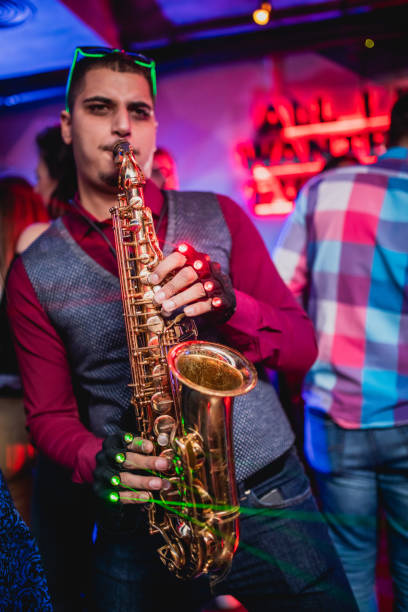 istock Saxophonist on club party 1199416288