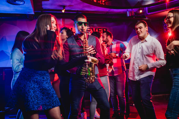 istock Saxophonist on club party 1199416303