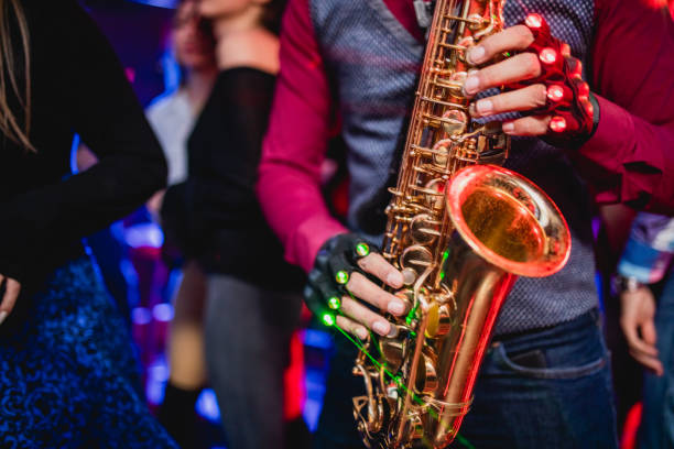 istock Saxophonist on club party 1199416369