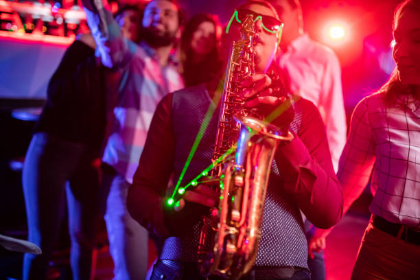 istock Saxophonist on club party 1199416461