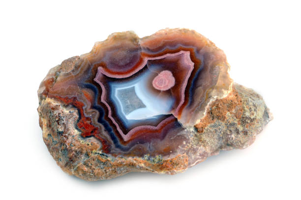 istock banded agate in red and blue color on isolated background. gem stone. 1199416515