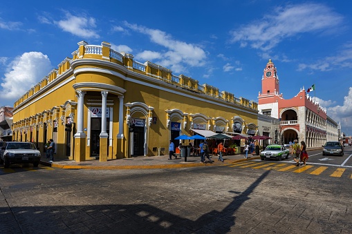 Mérida, Mexico, December 6, 2016: View of the central town square, Plaza Grande, with the Municipal Palace (pink building) which is the seat of the City Hall and Mayor's office. It is a beautiful example of colonial architecture. Mérida is the largest town on Yucatan Peninsula and a good starting point for excursions.