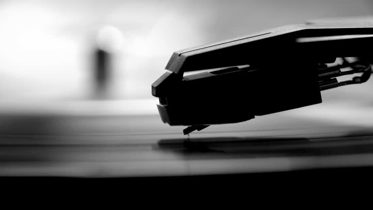 Stylus and record turntable. Monochrome.