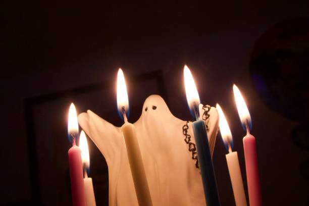 istock Ghost decoration on cake and candles for Halloween 1199419471