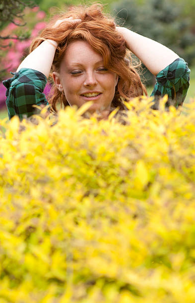 Happy Red-Haired Girl in Nature stock photo