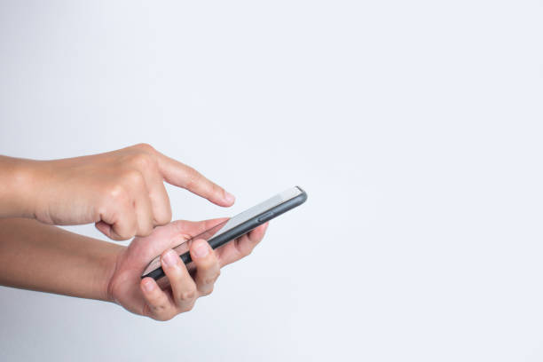 istock Close up, Side view, Asian people use a smartphone. Isolated white background. 1199420948