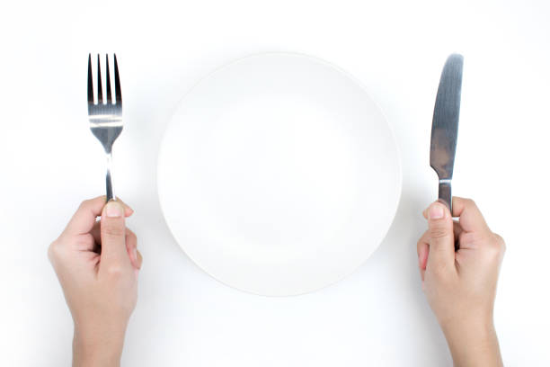 istock Plate and spoon in the top view, Isolated white background. 1199421079