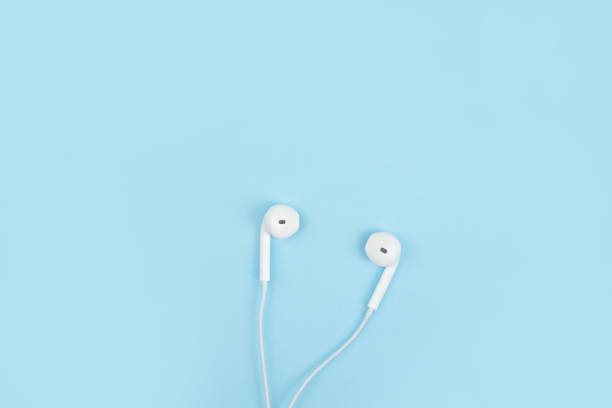 istock Earphone on a blue background. Close up. 1199421158