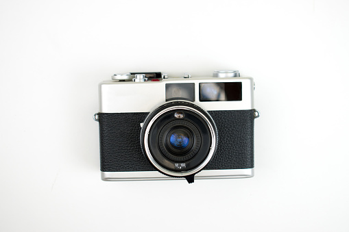 The top view of a film camera on a white background. Isolated background.