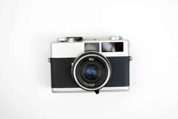 Photo of The top view of a film camera on a white background. Isolated background.