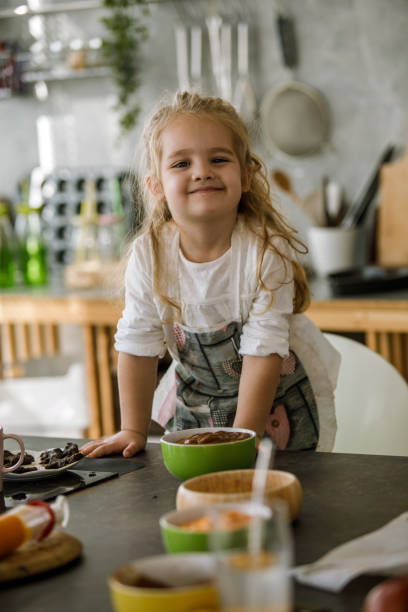 istock Proud little chef smiling and looking at camera 1199422029