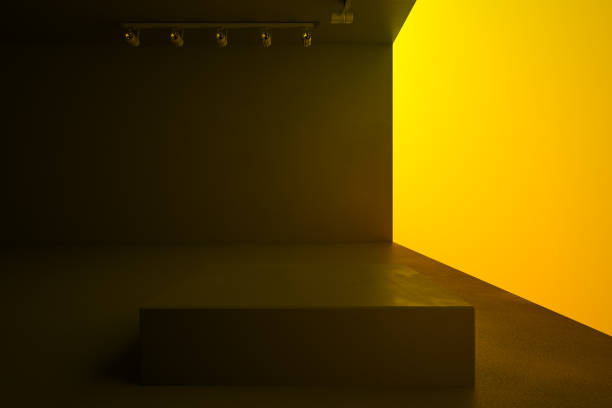 istock Empty spacious brown hall with lightning blank yellow wall and stand in the center, mock up. 1199422237