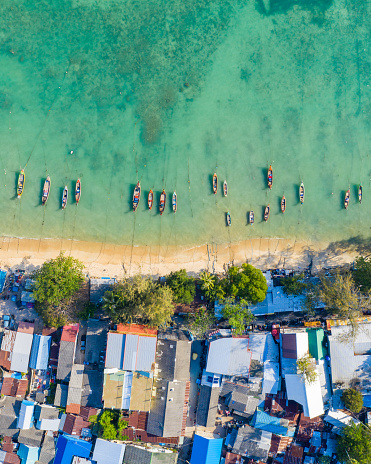 Areal view of coloured houses in a fishing village, photographed in Phuket Thailand