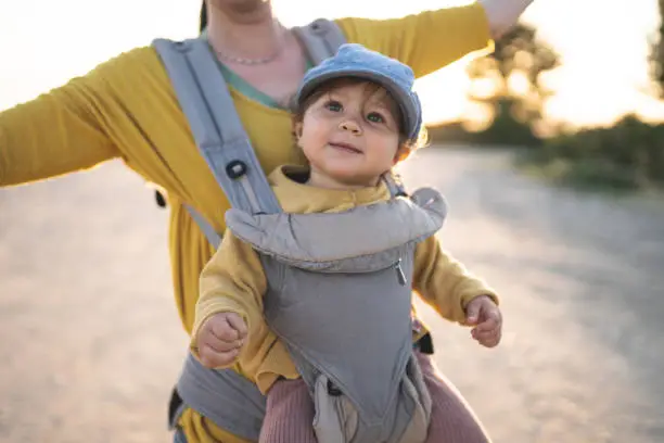 Photo of Mother walking on the beach with her daughter