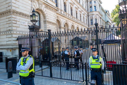 June 10, 2017 - London, United Kingdom: Police in front of the gated entrance to 10 Downing Street (Home of prime minister) from Whitehall in the City of Westminster, London