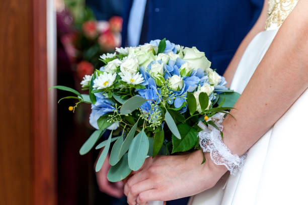 istock A wedding bouquet in hands of the bride 1199426514