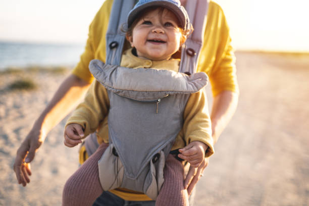 istock Mother walking on the beach with her daughter 1199427534