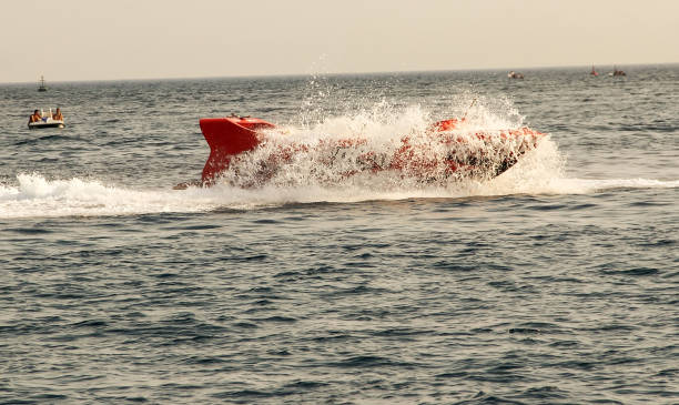 istock Sailing boat splashing water on the sea 1199431219