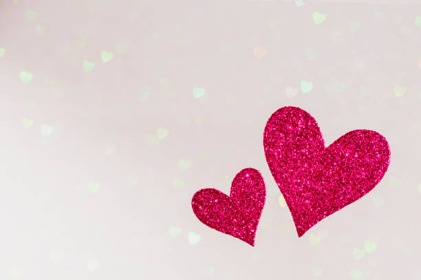 istock two red hearts on bright hearts bokeh background, valentines day concept design with copy space text, card template 1199432669