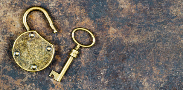 istock Solution, success concept, key and padlock on metal background 1199435945