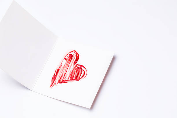 istock Lipstick-painted red heart on greeting card 1199436121