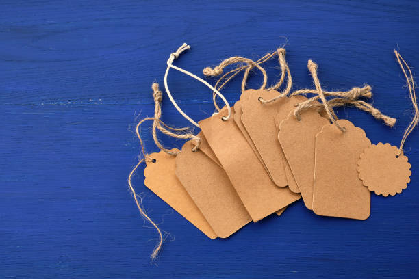 istock stack of empty brown empty tags from kraft paper with ropes for clothes and other purposes 1199436552
