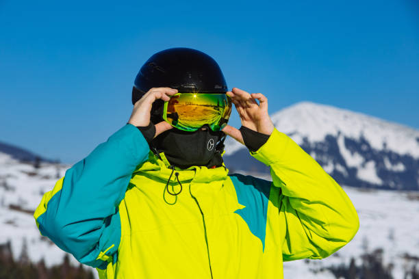 istock man in helmet and ski mask. reflection. winter activity 1199438257