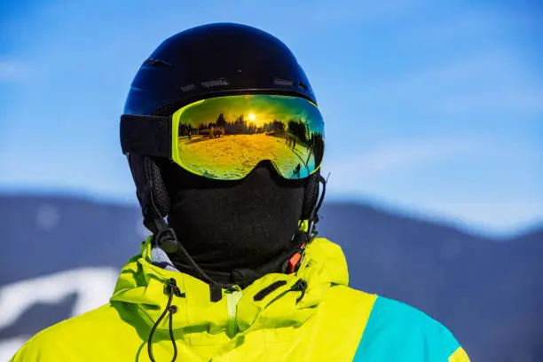 portrait of man in snowboard mask helmet and balaclava.