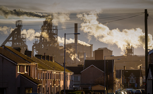 Editorial PORT TALBOT, UK - JANUARY 04, 2020: The houses of Port Talbot and the emissions of the TATA Steel works that provides employment for the townsfolk.