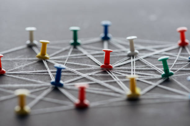 istock selective focus of colorful push pins connected with strings on grey, network concept 1199440531