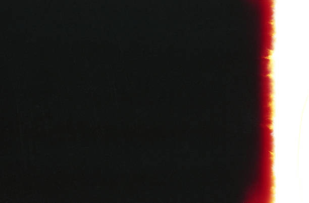 istock Old Light Leak Film Strip Grunge Texture Background 1199440580
