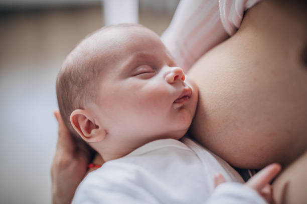 istock Mother breastfeeding her baby boy at home 1199440749