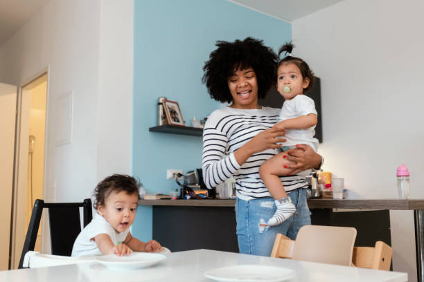 istock Mom and babies at home 1199443340
