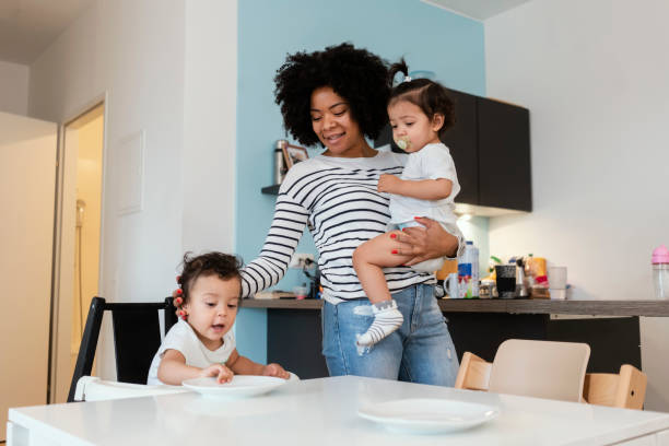 istock Mom and babies at home 1199443392