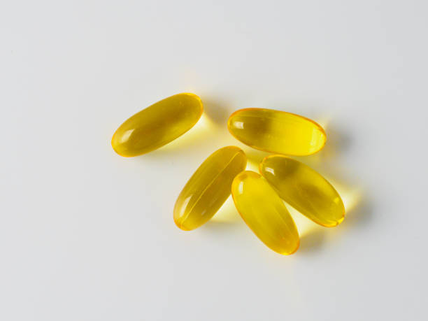 istock Omega 3 fish oil capsules isolated on white 1199443591