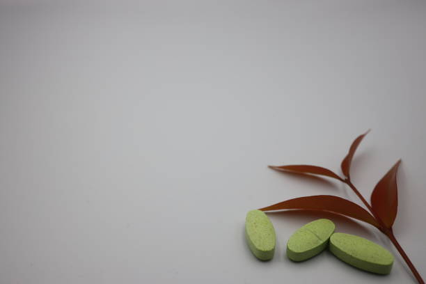 Herb capsules for Health on white background