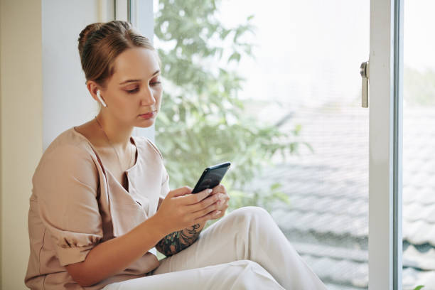 istock Woman Choosing Music Playlist 1199448124