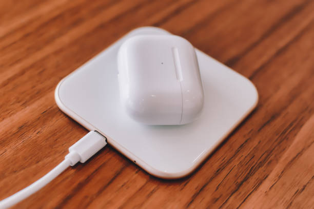 istock Wireless earphone charger on a wireless charging pad 1199448993