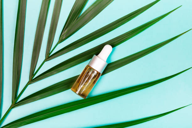 istock bottle of essential oil on blue background 1199449149