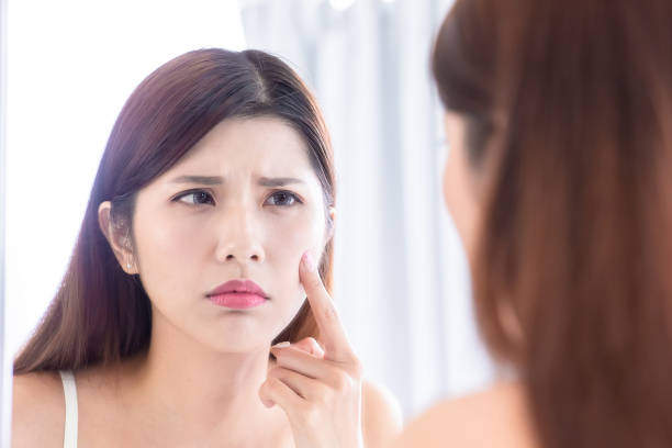 istock woman look mirror feel upset 1199449785