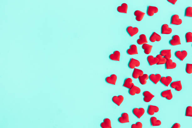 istock Valentine's Day background. Red hearts on pastel blue background. Valentines day concept. Flat lay, top view, copy space 1199450946